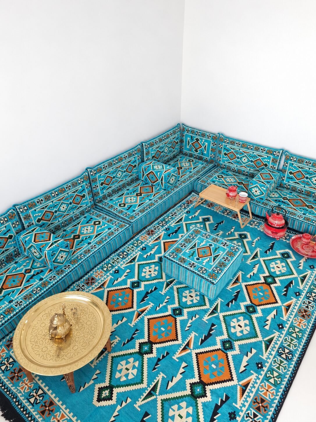 Ghrid turquoise Sahrawi majlis with matching rug and brass tray table
