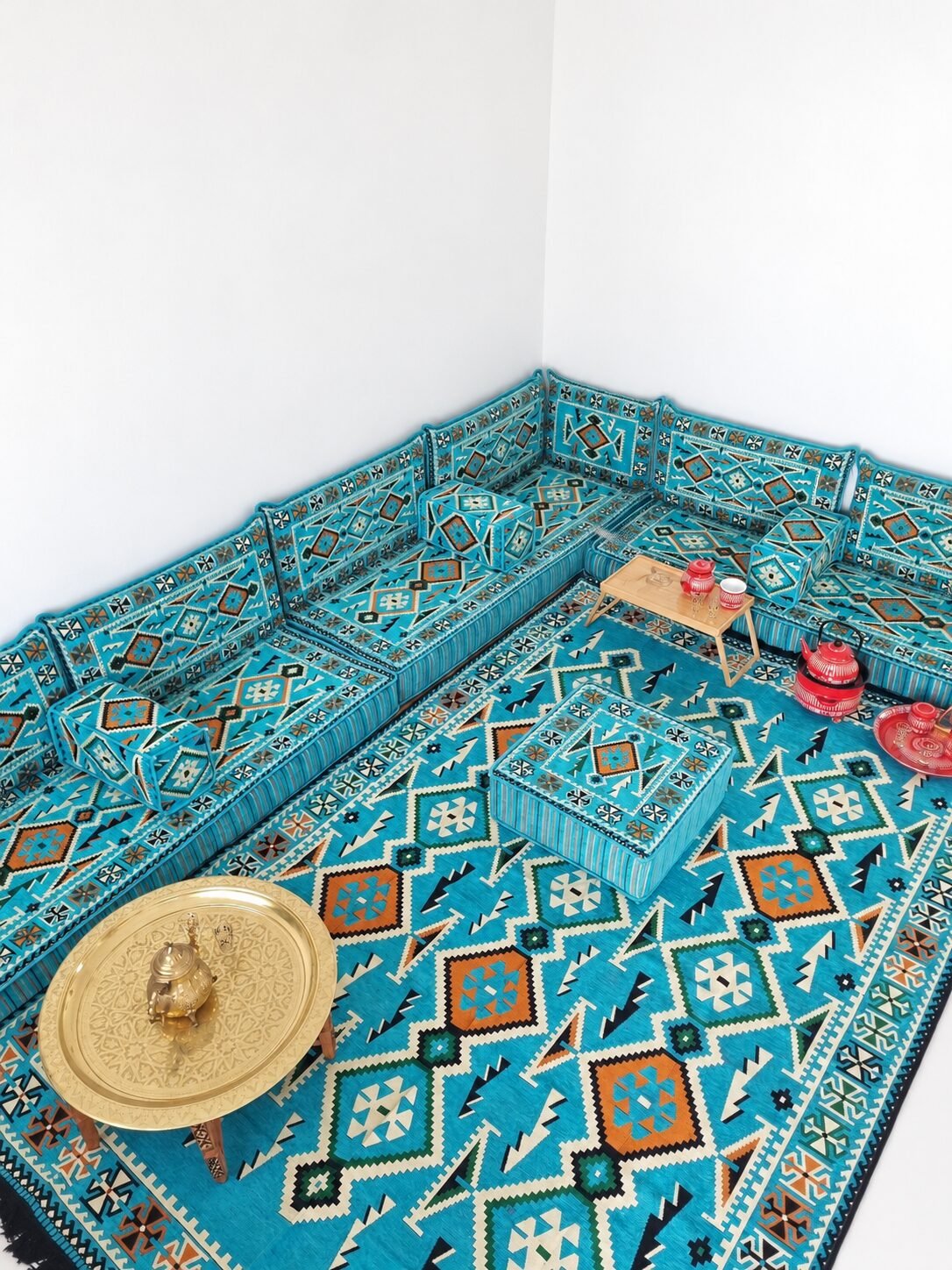 Turquoise Sahrawi majlis with a red tea set