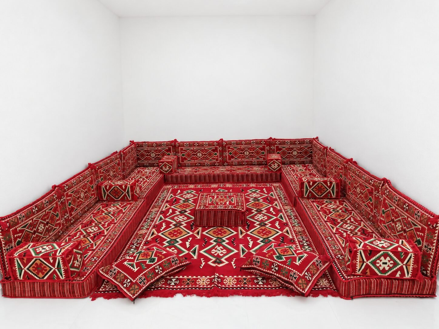 Red Sahrawi majlis along three walls