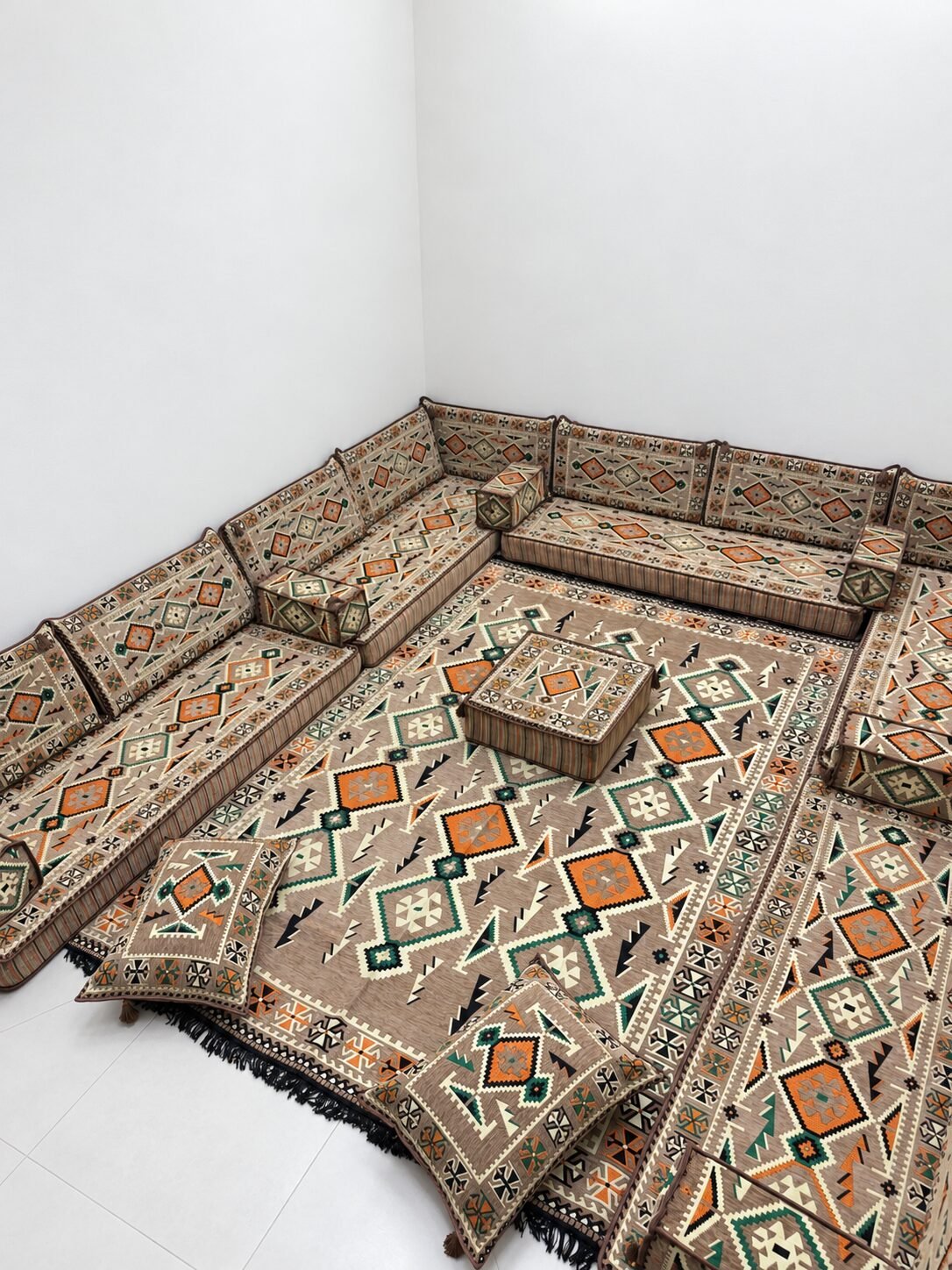 Beige Sahrawi majlis in a bright white room