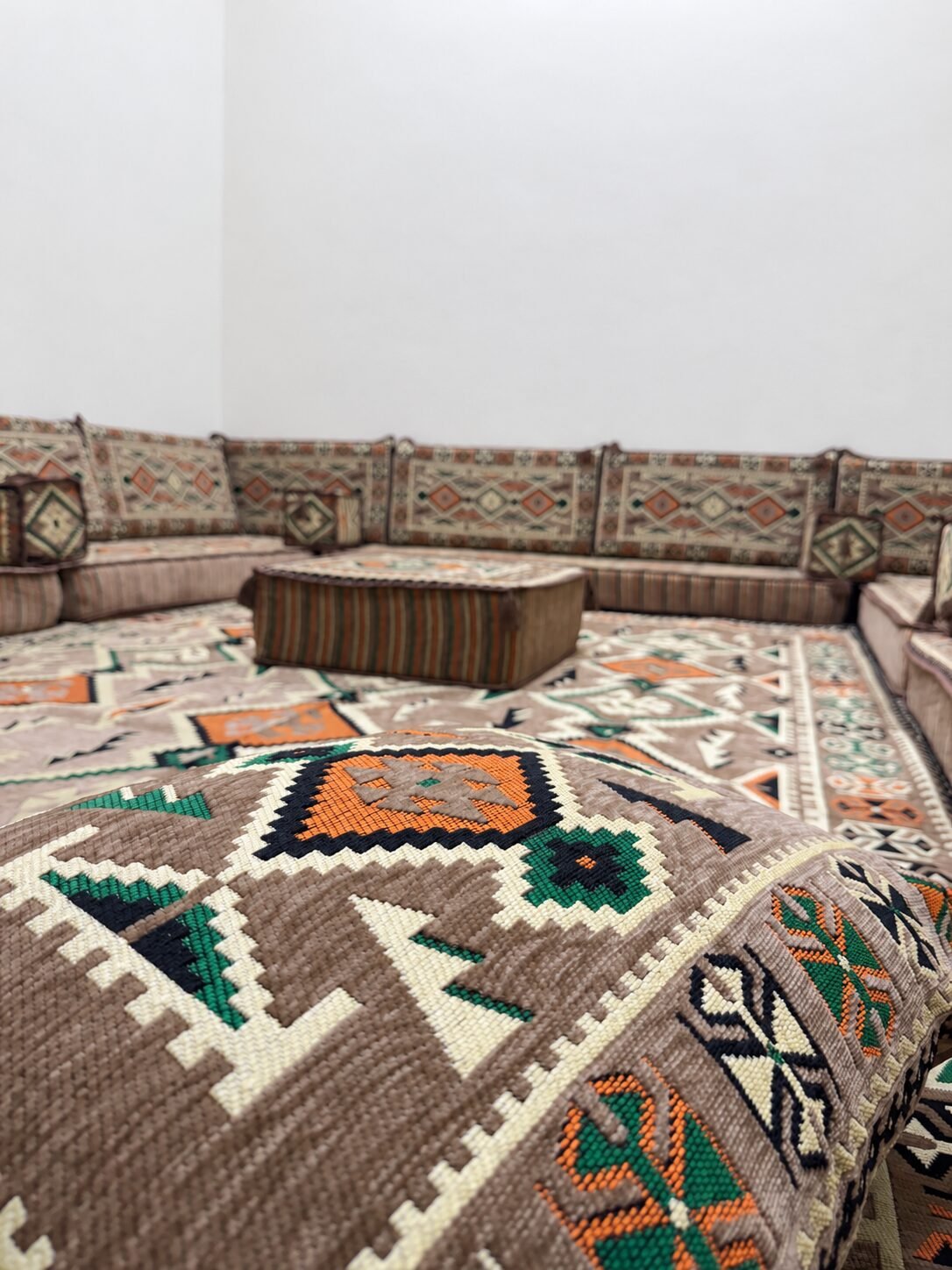 Close-up of a beige Sahrawi pouf and cushions