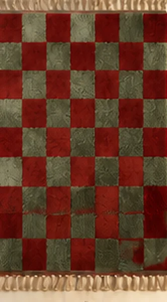 A rug with a red and sage green checkered pattern.