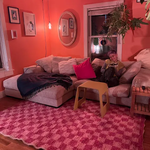 A handwoven Moroccan rug in a living room.