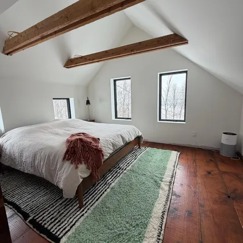 A handwoven Moroccan rug in a bedroom.