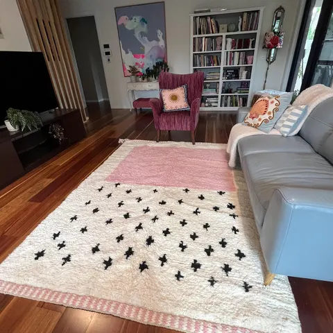 A handwoven Moroccan rug in a living room.