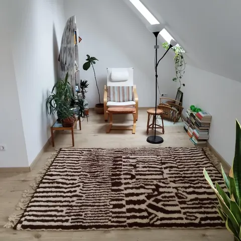 A handwoven Moroccan rug in a reading corner.
