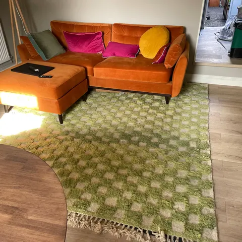 A handwoven Moroccan rug in a living room.