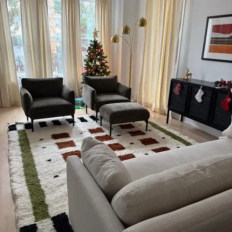 A handwoven Moroccan rug in a living room.